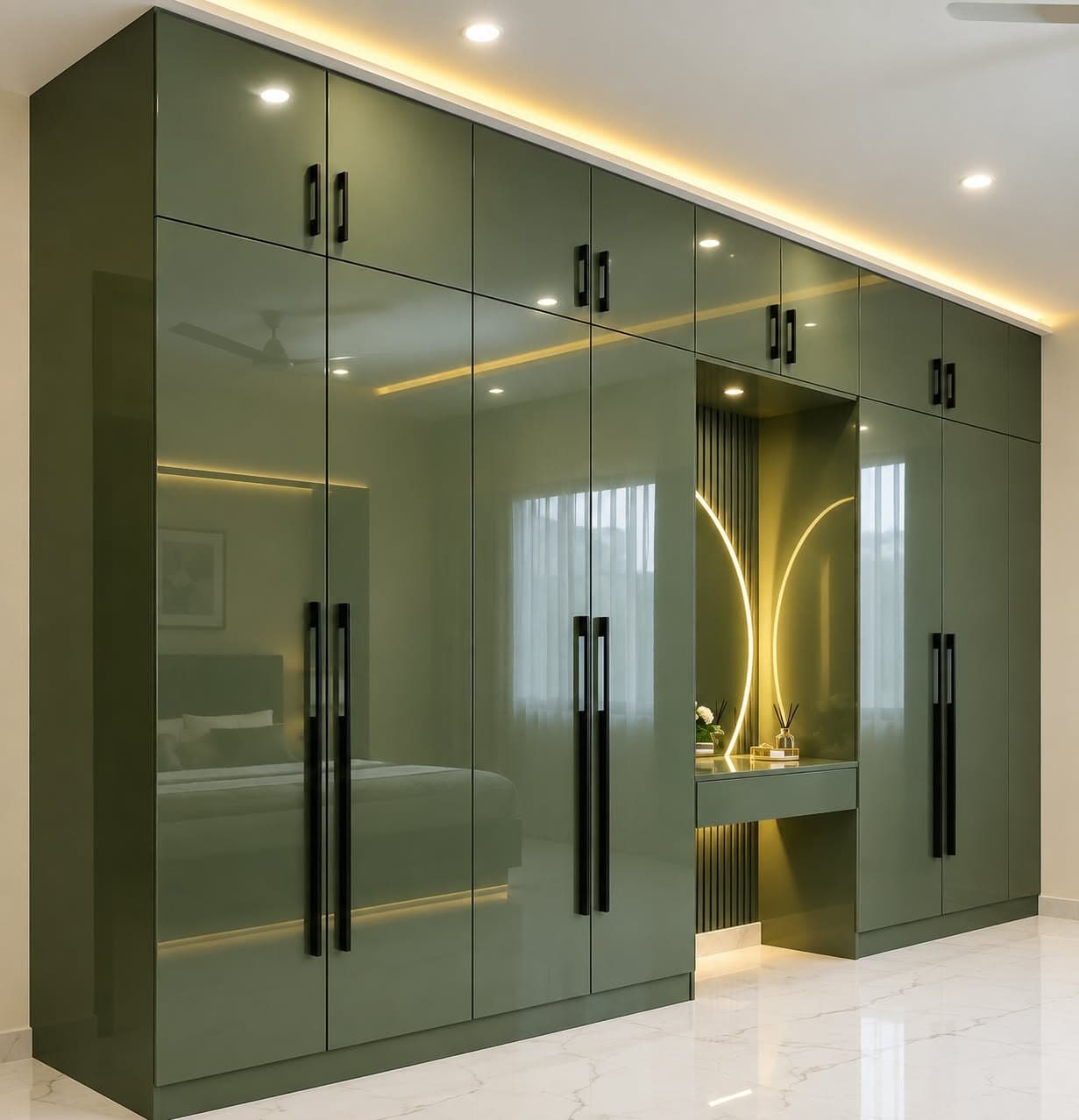 Floor-to-ceiling sage green high-gloss wardrobe with a backlit dresser niche and arched LED profile, designed by Decorators India